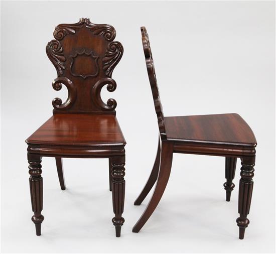 A pair of 19th century mahogany hall chairs,